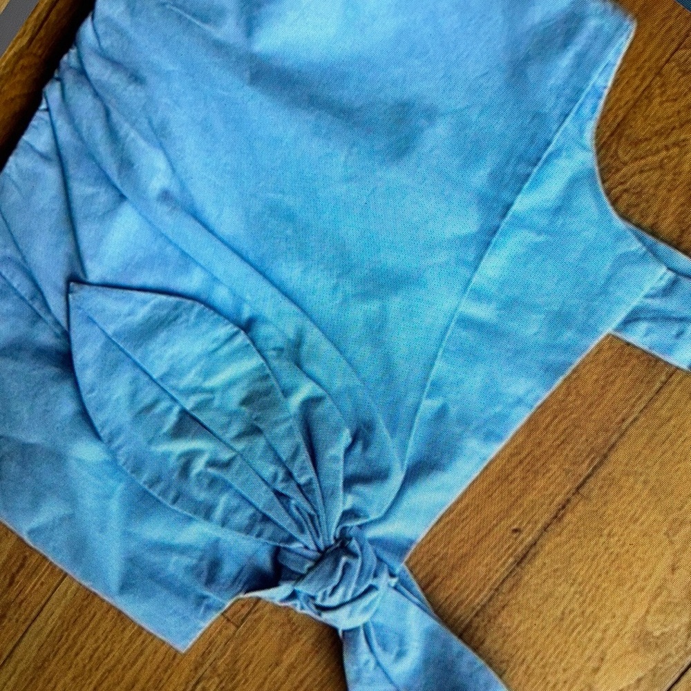 Chic light sleeveless blouse